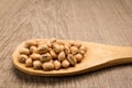 Cowpea legume. Grains in wooden spoon. Rustic.