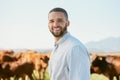 Cows, farm and black man portrait happy about cattle agriculture, farming and nature in summer. Grass field, ecology Royalty Free Stock Photo