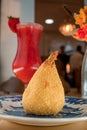 Coxinha of shrimp, traditional Brazilian snacks, Strawberry juice