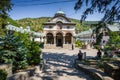 Cozia monastery church with visiting tourists