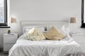 Cozy bedroom with cushions and bed linen at home Royalty Free Stock Photo