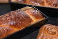 Cozonac. Romanian sweet bread. Traditional Christmas and Easter sweet bread dessert, called Cozonac in trays on a black Royalty Free Stock Photo