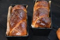 Cozonac. Romanian sweet bread. Traditional Christmas and Easter sweet bread dessert, called Cozonac in trays on a black