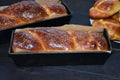 Cozonac. Romanian sweet bread. Traditional Christmas and Easter sweet bread dessert, called Cozonac in trays on a black Royalty Free Stock Photo