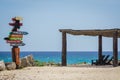 Cozumel distance sign and shaded chairs