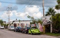 Cars for rent parked alongside the street on Cozumel Island, Mexico