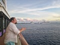 Cozumel, Mexico - December 5, 2019: Man tourist on cruise liner deck looking at sea ocean. Cruise ships staying at Cozumel Mexico Royalty Free Stock Photo