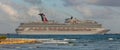 Cozumel, Mexico - February 11, 2020: Beautiful panoramic shot of Carnival Freedom docked in Costa Maya port. Shore line, splashing