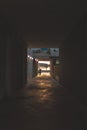 Cozy alleyway at sunset in Italy with illuminated lamps and parked scooter