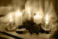 Candles and dried rosebuds on the table