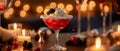 Cozy atmosphere in candlelight with a red cocktail, ice, whipped cream, blackberry and empty space Royalty Free Stock Photo