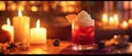 Cozy atmosphere in candlelight with a red cocktail, ice, whipped cream, blackberry and empty space Royalty Free Stock Photo