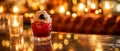 Cozy atmosphere in candlelight with a red cocktail, ice, whipped cream, blackberry and empty space Royalty Free Stock Photo