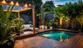 the cozy atmosphere of a homely patio in the back garden with wooden decking, tropical plants and a mini-pool