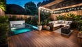 the cozy atmosphere of a homely patio in the back garden with wooden decking, tropical plants and a mini-pool