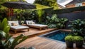 the cozy atmosphere of a homely patio in the back garden with wooden decking, tropical plants and a mini-pool