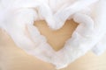 Cozy Atmospheric Background With White Fur Folded In The Shape Of Heart.