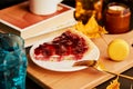 Cozy atmospheric home breakfast with cherry pie and macaroons. Seasonal autumn coffee time. Hygge home aesthetic