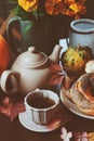Cozy autumn breakfast on table in country house