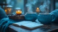 Cozy autumn evening with hot drinks, candles, and book Royalty Free Stock Photo