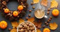 Cozy Autumn Flat Lay with Steaming Coffee, Pumpkins, and Harvest Nuts Royalty Free Stock Photo