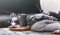 Cozy autumn morning breakfast in bed still life scene. Steaming cup of hot coffee, tea standing near window. Fall Royalty Free Stock Photo