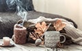 Cozy autumn morning breakfast in bed still life scene. Steaming cup of hot coffee, tea standing near window. Fall Royalty Free Stock Photo