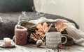 Cozy autumn morning breakfast in bed still life scene. Steaming cup of hot coffee, tea standing near window. Fall Royalty Free Stock Photo