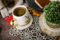 Cozy autumn still life with cup of hot black coffee. knitted hat and scarf on wooden background Royalty Free Stock Photo