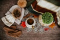 Cozy autumn still life with cup of hot black coffee. knitted hat and scarf on wooden background Royalty Free Stock Photo