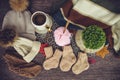 Cozy autumn still life with cup of hot black coffee. knitted hat and scarf on wooden background