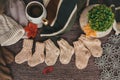 Cozy autumn still life with cup of hot black coffee. knitted hat and scarf on wooden background Royalty Free Stock Photo