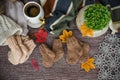 Cozy autumn still life with cup of hot black coffee. knitted hat and scarf on wooden background Royalty Free Stock Photo