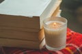 Cozy autumn still life: cup of hot coffee and opened book on vintage windowsill and rain outside. Autumn. Apartment. Rain