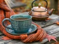 Cozy Autumn Tea Time Ceramic Cup and Teapot Among Fallen Leaves on Rustic Wooden Table