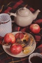 Cozy autumn weekend morning at home. Breakfast with cup of tea and bagel with apples Royalty Free Stock Photo