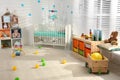 Cozy baby room interior with crib Royalty Free Stock Photo