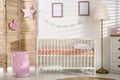 Baby room interior with comfortable crib Royalty Free Stock Photo