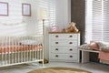 Cozy baby room interior with crib Royalty Free Stock Photo