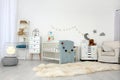 Cozy baby room interior with crib Royalty Free Stock Photo