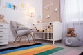 Cozy baby room interior with crib Royalty Free Stock Photo