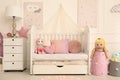 Cozy baby room interior with crib and toys Royalty Free Stock Photo