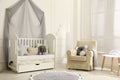 Cozy baby room interior with crib and toys Royalty Free Stock Photo