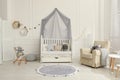 Cozy baby room interior with crib and toys Royalty Free Stock Photo