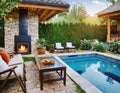 Cozy backyard or patio area with garden furniture, swimming pool and outdoor fireplace Royalty Free Stock Photo