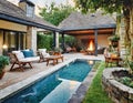 Cozy backyard or patio area with garden furniture, swimming pool and outdoor fireplace Royalty Free Stock Photo