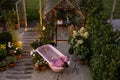 Cozy backyard with a woman bathing in pink bathtub Royalty Free Stock Photo