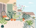 Cozy balcony garden with potted green plants. Terrace eco-style interior design with rattan wicker chair, houseplants in Royalty Free Stock Photo