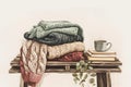 Cozy beautiful knitted ugly sweaters in pastel colors stacked on a small bench with a stack of books and a cup of Royalty Free Stock Photo