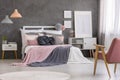 Cozy bed in pastel bedroom Royalty Free Stock Photo